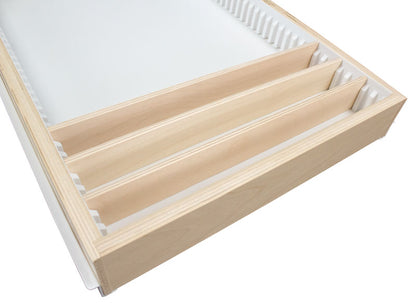 Adjustable birch dividers installed in pull-out cabinet drawer with binning strips