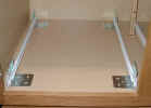 Click for larger picture.  Installing pull out shelves using L brackets on full shelf or cabinet base